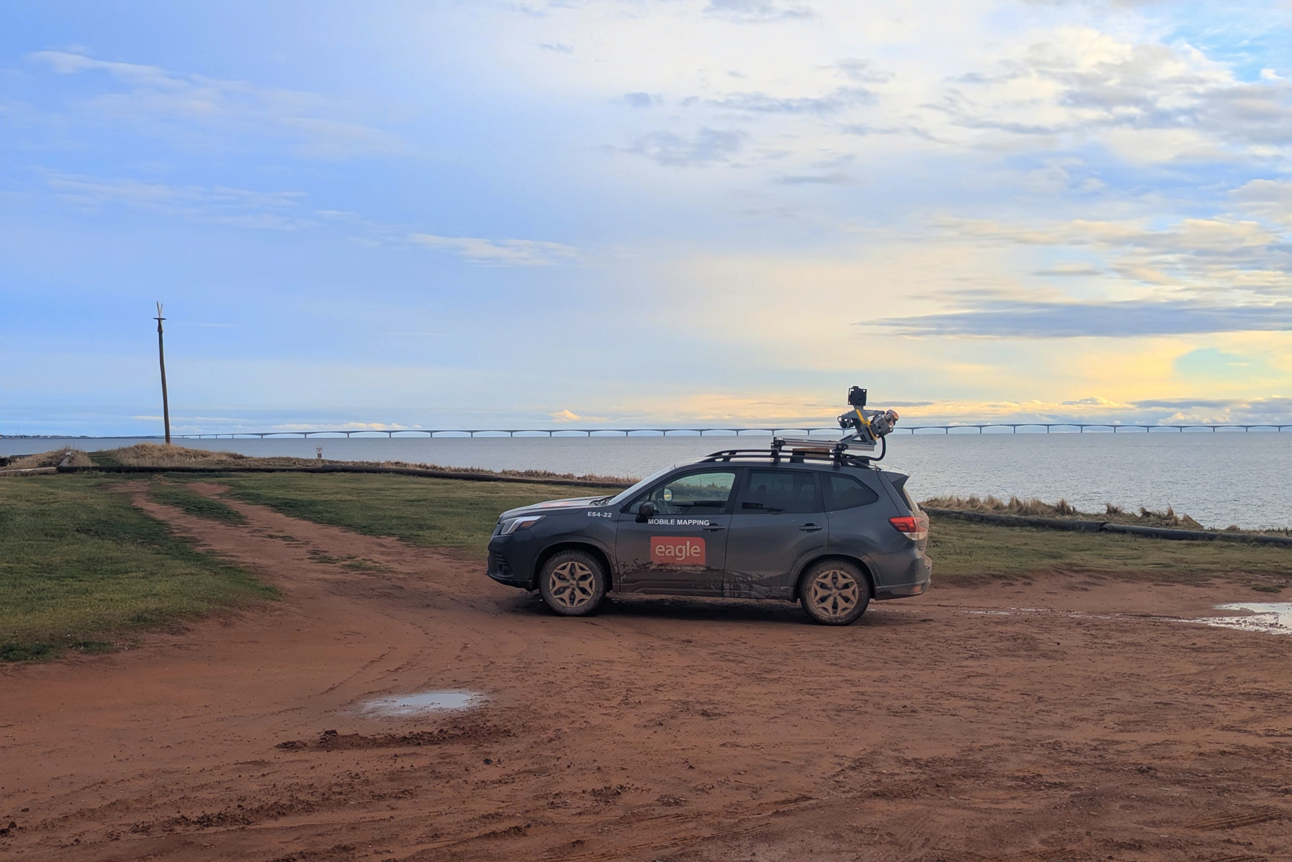 Eagle Engineering Subaru with Top Mounted camera, by a body of water.
